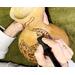 This image shows me drawing the cat artwork. I use pyrography tools or wood-burning pens to engrave artwork into the gourd shell.